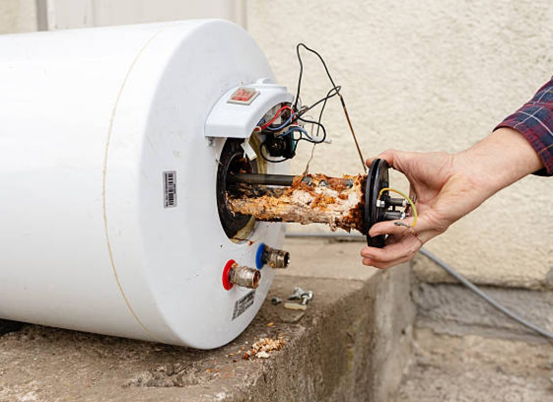 Water Heater Replacement in Jonesborough, TN as a plumber connects a new tank in a basement